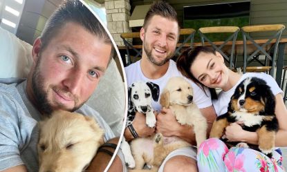Tim Tebow and his wife Demi-Leigh Nel-Peters with their puppies..